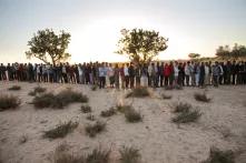 Hundreds of refugees from Libya line up for food at a transit camp near the Tunisia-Libya border.