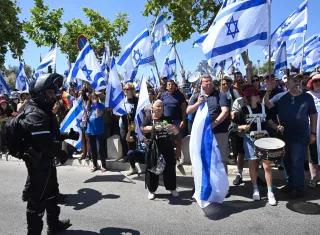 Israelis protesters hold Israeli flags and chant for democracy at a demonstration against Prime Minister Benjamin Netanyahu s judicial overhaul, outside the Supreme Court in Jerusalem, on Tuesday, July 11, 2023.